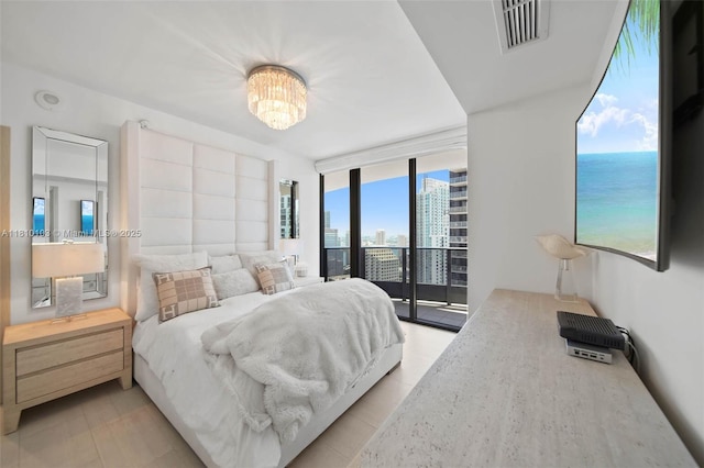 1000 Brickell Plz Unit 4209, Miami, FL 33131 - bedroom with access to outside, a chandelier, expansive windows, and a city view