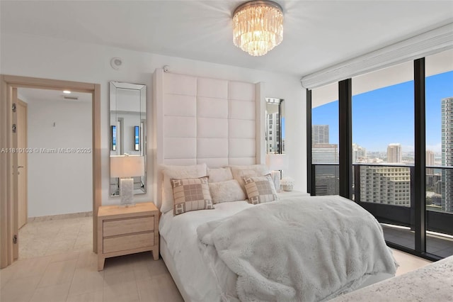 1000 Brickell Plz Unit 4209, Miami, FL 33131 - bedroom with floor to ceiling windows, a chandelier, and a view of city