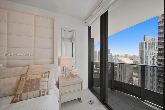 1000 Brickell Plz Unit 4209, Miami, FL 33131 - tiled bedroom with a view of city and floor to ceiling windows