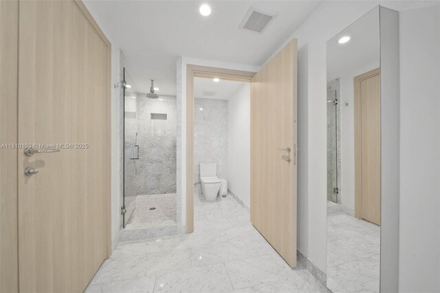 1000 Brickell Plz Unit 4209, Miami, FL 33131 - bathroom with recessed lighting, a marble finish shower, marble finish floors, and toilet