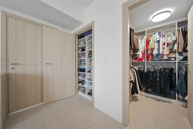 1000 Brickell Plz Unit 4209, Miami, FL 33131 - spacious closet featuring tile patterned flooring