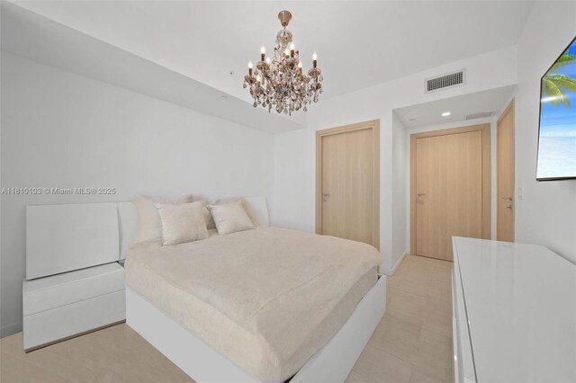 1000 Brickell Plz Unit 4209, Miami, FL 33131 - bedroom featuring a chandelier and recessed lighting