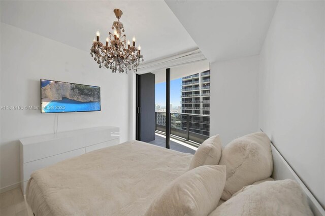 1000 Brickell Plz Unit 4209, Miami, FL 33131 - bedroom with access to exterior, a chandelier, and expansive windows