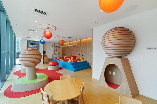 1000 Brickell Plz Unit 4209, Miami, FL 33131 - playroom featuring wood finished floors