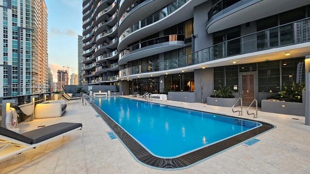 1000 Brickell Plz Unit 4209, Miami, FL 33131 - community pool with a view of city and a patio area