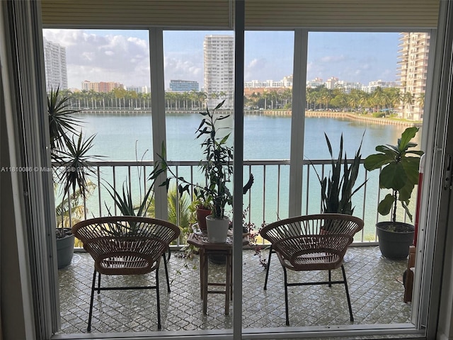 2999 Point E Dr Unit C-409, Aventura, FL 33160 - sunroom with plenty of natural light, a city view, and a water view