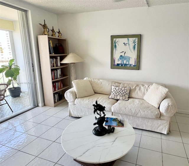 2999 Point E Dr Unit C-409, Aventura, FL 33160 - living room with tile patterned flooring and a textured ceiling