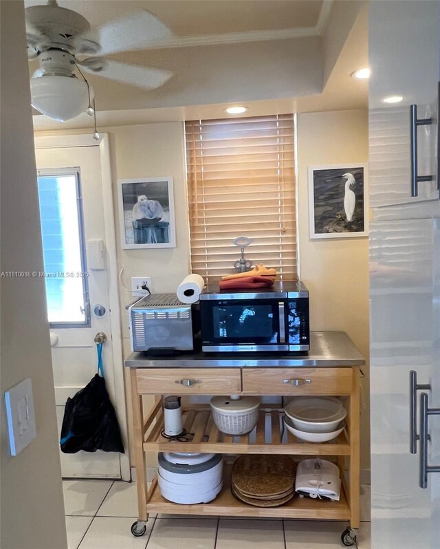 2999 Point E Dr Unit C-409, Aventura, FL 33160 - kitchen with stainless steel microwave, tile patterned floors, and ceiling fan