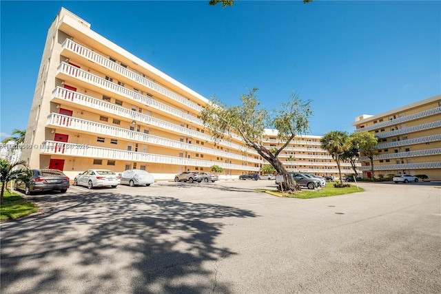 2999 Point E Dr Unit C-409, Aventura, FL 33160 - view of apartment building / complex featuring uncovered parking