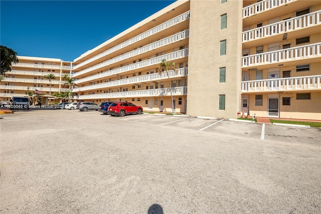 2999 Point E Dr Unit C-409, Aventura, FL 33160 - view of apartment building / complex with uncovered parking