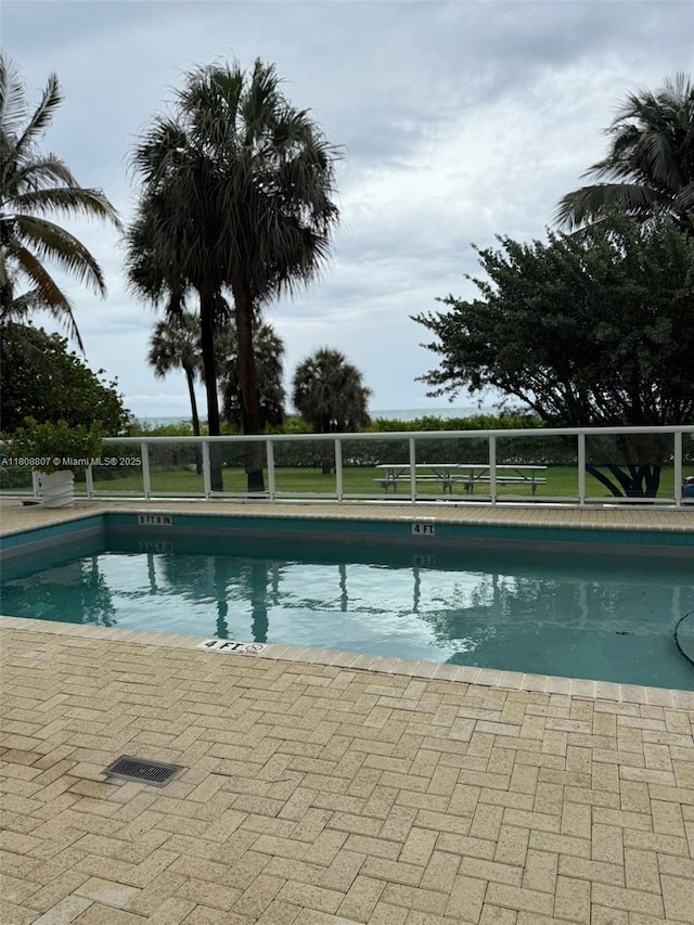 8911 Collins Ave Unit 1103, Surfside, FL 33154 - community pool with a patio area