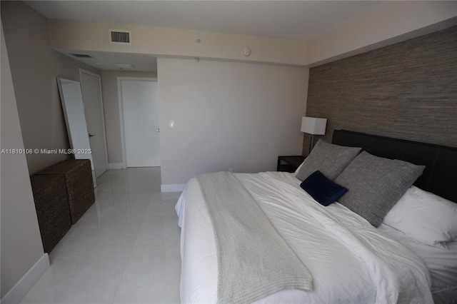 325 S Biscayne Blvd Unit 1822, Miami, FL 33131 - bedroom with light tile patterned floors and baseboards
