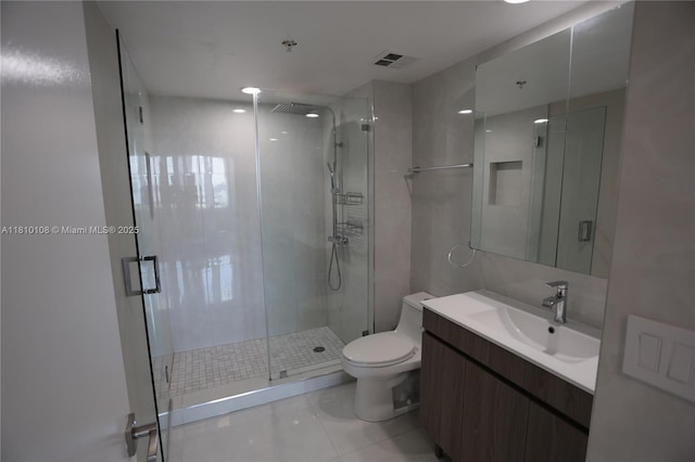 325 S Biscayne Blvd Unit 1822, Miami, FL 33131 - full bathroom featuring a shower stall, vanity, toilet, and tile patterned floors