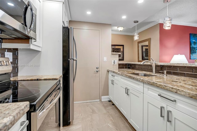 720 Bayshore Dr Unit 804, Fort Lauderdale, FL 33304 - kitchen featuring stainless steel appliances, a sink, white cabinets, decorative light fixtures, and crown molding