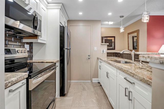 720 Bayshore Dr Unit 804, Fort Lauderdale, FL 33304 - kitchen with appliances with stainless steel finishes, a sink, ornamental molding, white cabinetry, and tasteful backsplash