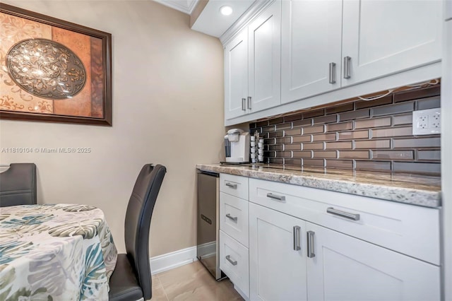 720 Bayshore Dr Unit 804, Fort Lauderdale, FL 33304 - kitchen with backsplash, baseboards, light stone counters, white cabinets, and recessed lighting