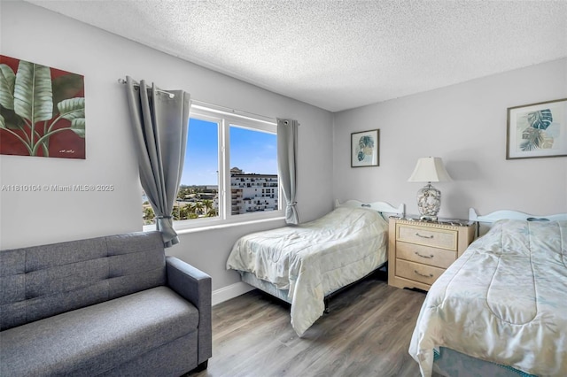 720 Bayshore Dr Unit 804, Fort Lauderdale, FL 33304 - bedroom with wood finished floors, a textured ceiling, and baseboards