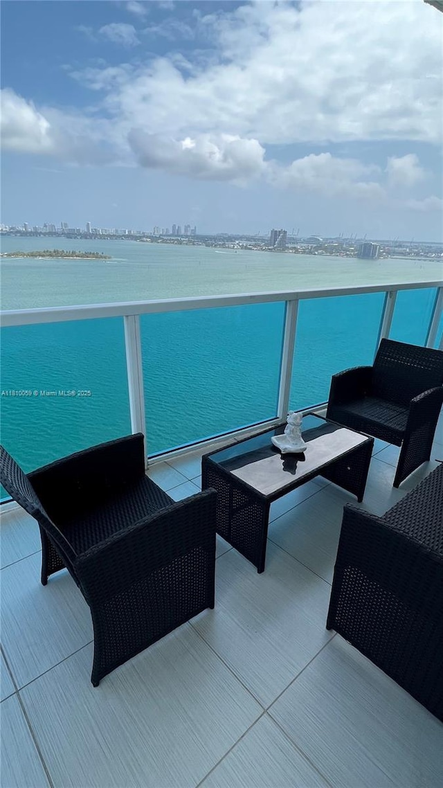 700 NE 25th St Unit 1703, Miami, FL 33137 - view of patio / terrace with a balcony and a water view