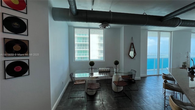 700 NE 25th St Unit 1703, Miami, FL 33137 - dining area with baseboards