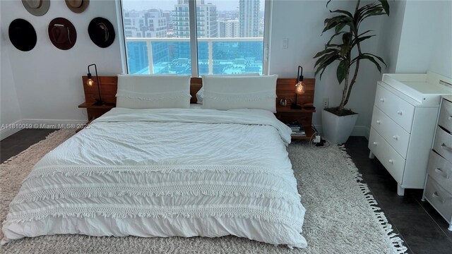 700 NE 25th St Unit 1703, Miami, FL 33137 - bedroom featuring a city view and baseboards