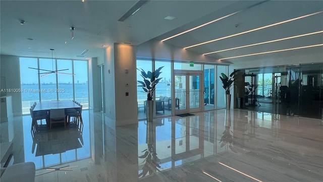 700 NE 25th St Unit 1703, Miami, FL 33137 - workout area featuring french doors and marble tiled floors