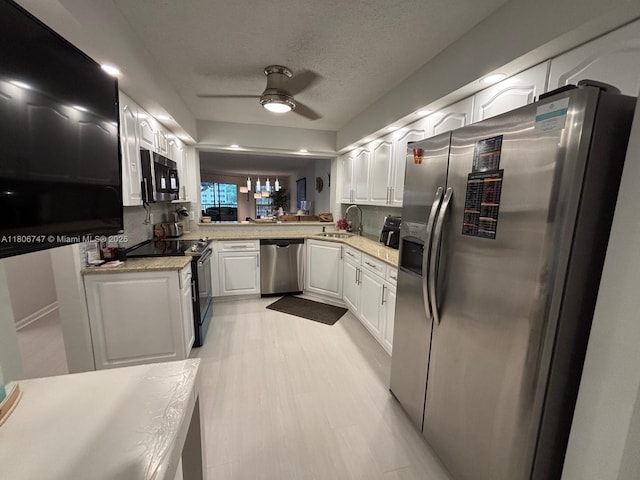 7443 Fairfax Dr Unit 208, Tamarac, FL 33321 - kitchen featuring appliances with stainless steel finishes, a ceiling fan, white cabinets, light countertops, and a textured ceiling