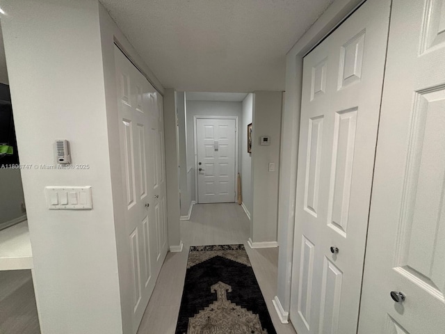 7443 Fairfax Dr Unit 208, Tamarac, FL 33321 - hall featuring baseboards