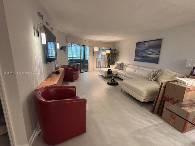 7443 Fairfax Dr Unit 208, Tamarac, FL 33321 - living area with wood finished floors