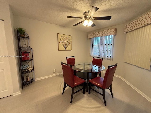 7443 Fairfax Dr Unit 208, Tamarac, FL 33321 - dining room with ceiling fan, a textured ceiling, and wood finished floors