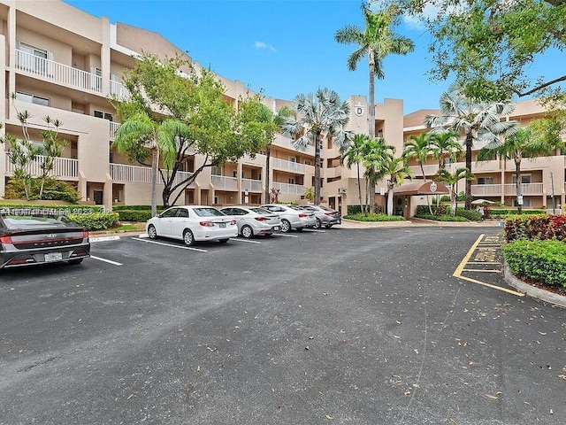 7443 Fairfax Dr Unit 208, Tamarac, FL 33321 - uncovered parking lot featuring a residential view