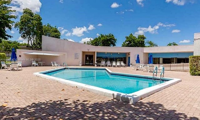 7443 Fairfax Dr Unit 208, Tamarac, FL 33321 - community pool featuring a patio