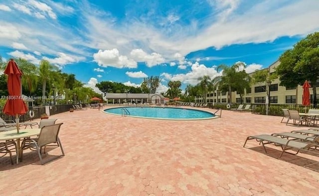 7443 Fairfax Dr Unit 208, Tamarac, FL 33321 - community pool featuring a patio area