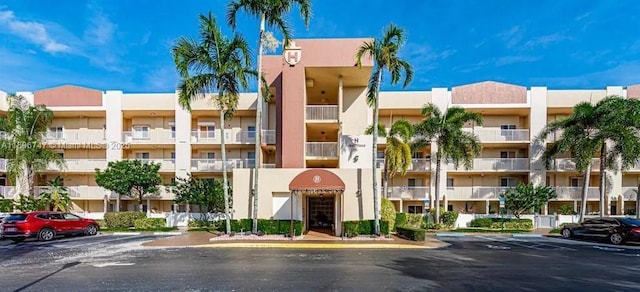 7443 Fairfax Dr Unit 208, Tamarac, FL 33321 - view of apartment building / complex featuring uncovered parking