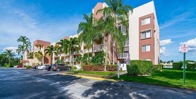 7443 Fairfax Dr Unit 208, Tamarac, FL 33321 - view of property with uncovered parking