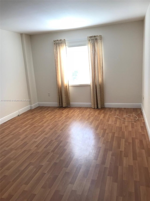 200 178th Dr Unit 505, Sunny Isles Beach, FL 33160 - unfurnished room with wood finished floors and baseboards