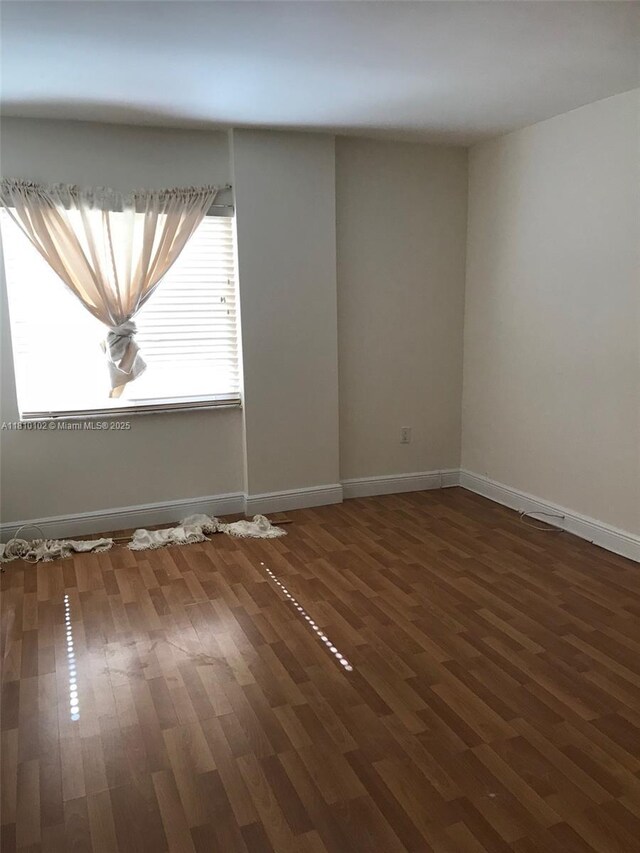 200 178th Dr Unit 505, Sunny Isles Beach, FL 33160 - unfurnished room featuring wood finished floors and baseboards
