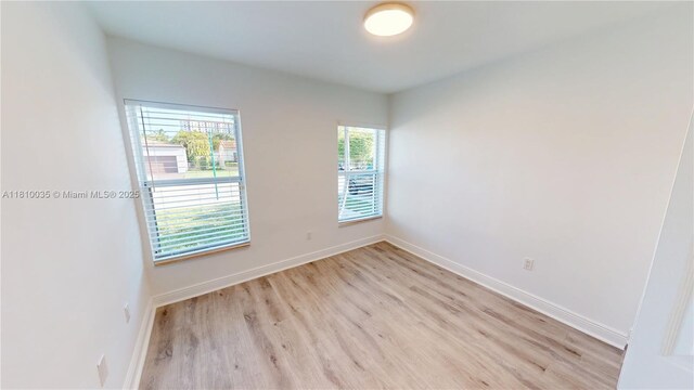 7 Montilla Ave, Coral Gables, FL 33134 - empty room featuring light wood-style floors and baseboards