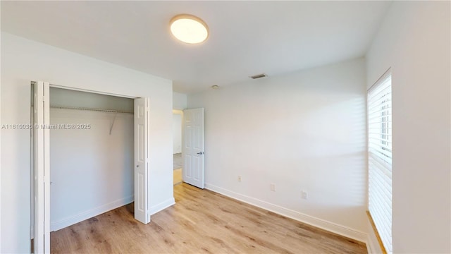 7 Montilla Ave, Coral Gables, FL 33134 - unfurnished bedroom featuring light wood-style floors and a closet