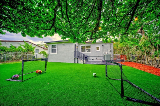 7 Montilla Ave, Coral Gables, FL 33134 - rear view of property featuring stucco siding and central air condition unit