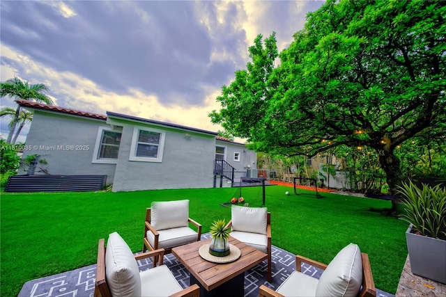 7 Montilla Ave, Coral Gables, FL 33134 - patio terrace at dusk with an outdoor living space