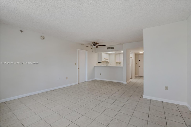 540 Brickell Key Dr Unit 718, Miami, FL 33131 - unfurnished living room featuring a ceiling fan, a textured ceiling, and baseboards