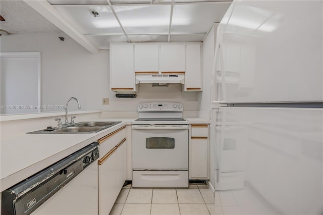 540 Brickell Key Dr Unit 718, Miami, FL 33131 - kitchen featuring white appliances, a sink, under cabinet range hood, light countertops, and light tile patterned floors