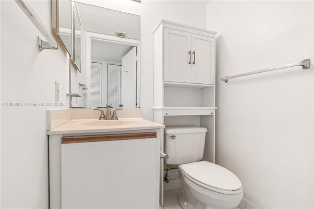 540 Brickell Key Dr Unit 718, Miami, FL 33131 - half bathroom featuring toilet, vanity, and tile patterned flooring