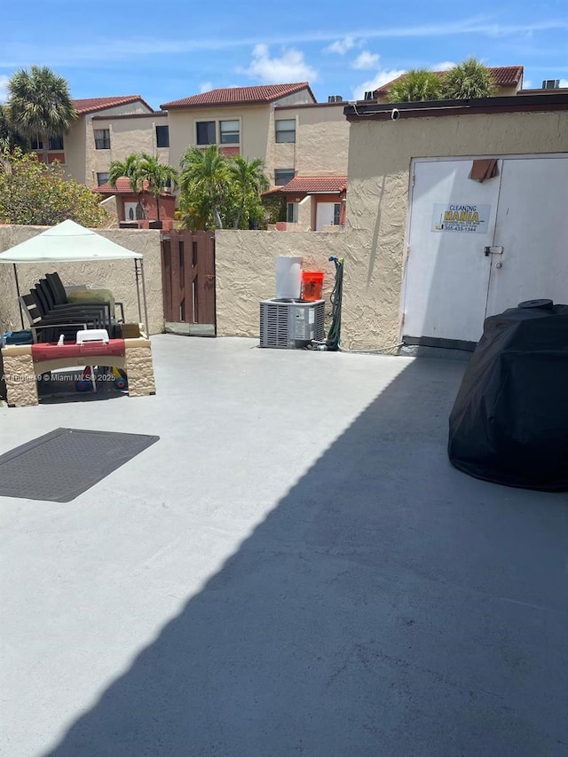 9999 NW 9th St Cir Unit 1-11, Miami, FL 33172 - view of patio featuring cooling unit