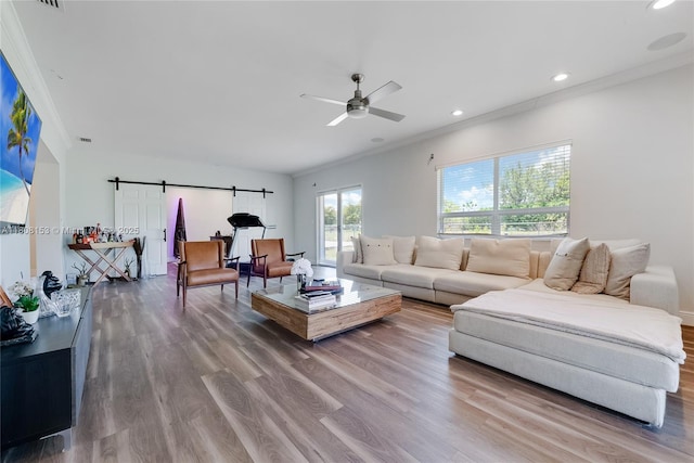 8005 SW 106th St, Miami, FL 33156 - living area with ceiling fan, wood finished floors, ornamental molding, a barn door, and recessed lighting
