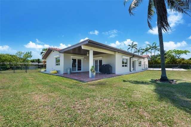 8005 SW 106th St, Miami, FL 33156 - rear view of property featuring stucco siding, a ceiling fan, and a patio area