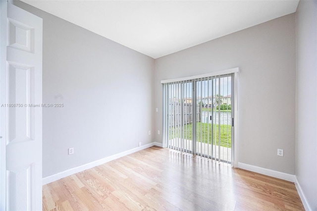 1005 NE 41st Ave, Homestead, FL 33033 - unfurnished room with light wood-style floors and baseboards