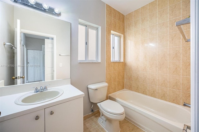 1005 NE 41st Ave, Homestead, FL 33033 - bathroom with toilet, tile patterned floors, vanity, shower / bathtub combination, and baseboards