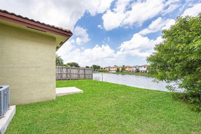 1005 NE 41st Ave, Homestead, FL 33033 - view of yard featuring a water view and central air condition unit