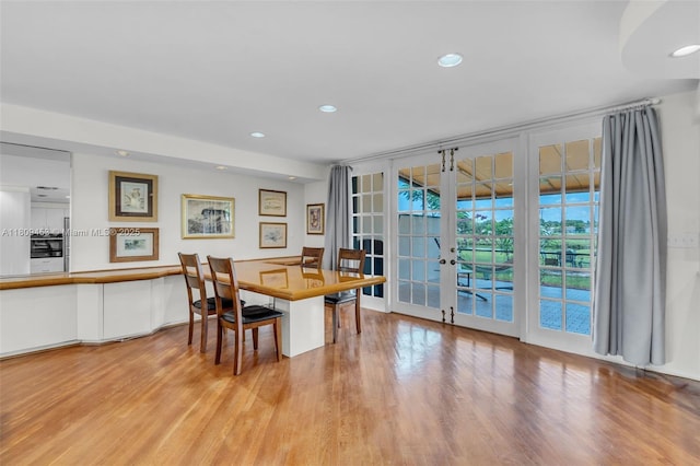 7619 SW 102nd Pl, Miami, FL 33173 - dining space with french doors, wood finished floors, and recessed lighting